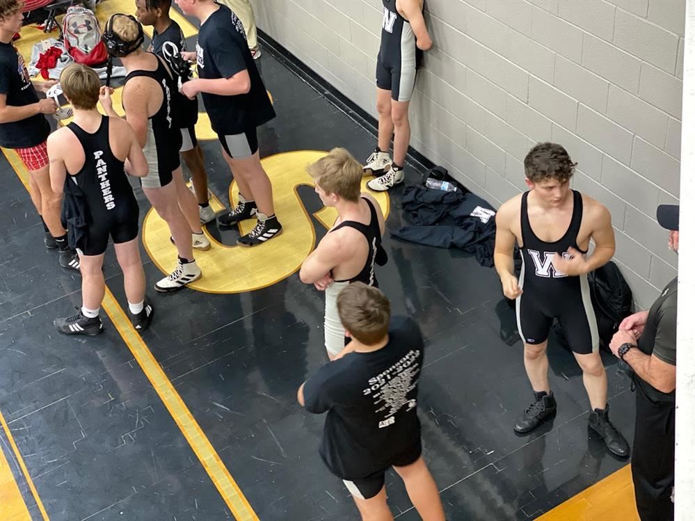 Wellborn wrestlers discussing strategy before their next dual