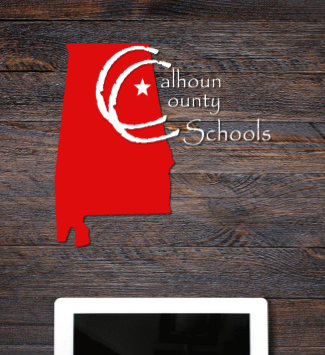  calhoun county schools logo on brown wood textured background