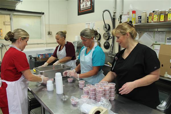 Alexandria High School CNP Workers preparing for the day's meal.